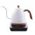 White electric kettle with a 900 ml capacity, featuring a wooden handle on a black base against a white background.