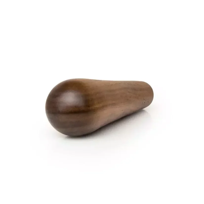 The walnut M10 portafilter handle from Heavy Tamper, made from high-quality wood, is ideal for baristas seeking a stylish and functional accessory.