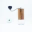 Manual coffee grinder Comandante C40 MK4 Nitro Virginia Walnut with a small label.
