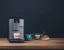 Nivona NICR 795 coffee machine placed on a table with cappuccino and dessert