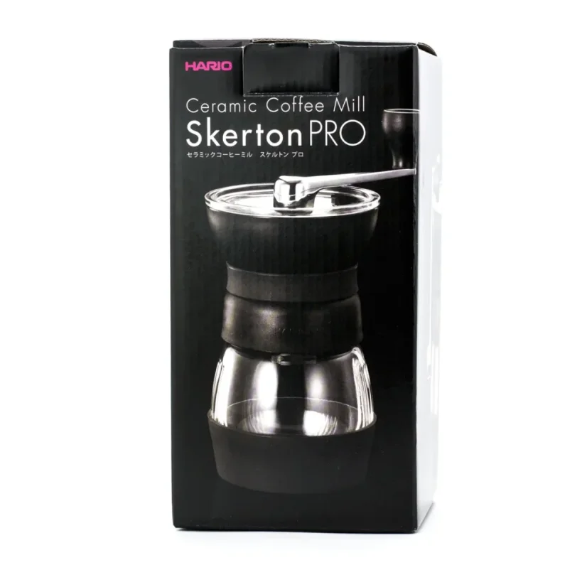 Hand-operated Hario Skerton Pro grinder in original packaging on a white background.