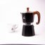 Moka pot Forever next to the espresso cup with the Spa Coffee logo.