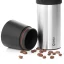 Detail of the black funnel of the Kinu M47 Phoenix manual grinder, complemented by coffee beans Detail of the black funnel of the Kinu M47 Phoenix manual grinder, complemented by coffee beans