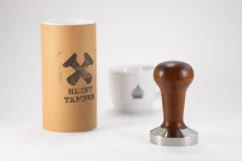 51.5 mm Heavy Tamper base and a cup of coffee