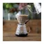 A Hario V60-03 dripper egy elegáns fekete kávéfőző, amely üvegből készült, és tökéletes kávéextrakciót biztosít.