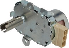 Getriebemotor mat engem Metallgehäus, enger Ausgangswell mat enger Rill an engem beige Stecker. Getriebemotor mat engem Metallgehäus, enger Ausgangswell mat enger Rill an engem beige Stecker.