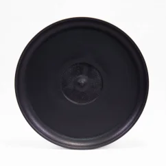 Black Huskee saucer on a white background, top view