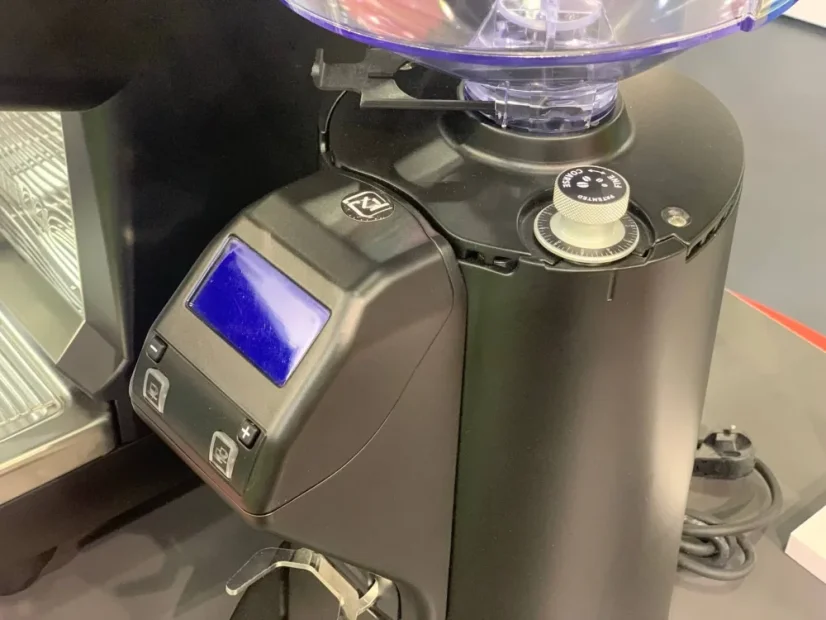 Black Nuova Simonelli MDXS CORE espresso coffee grinder, marked as high quality.
