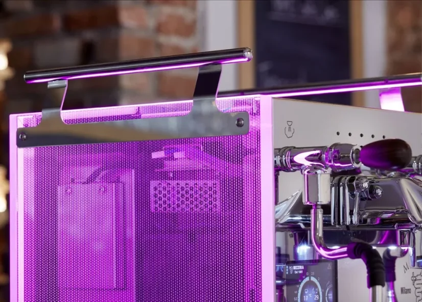 Purple glowing sides of the coffee machine Bezzera.