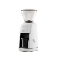 White electric universal coffee grinder from the side. White electric universal coffee grinder from the side.