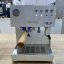Ascaso Steel UNO PID coffee machine in white with wooden elements, meets standard quality.
