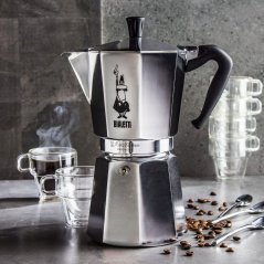 Bialetti Moka Express with transparent cups in the background.