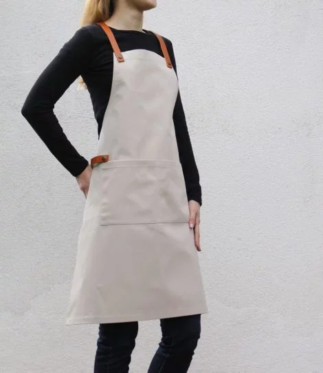 Beige barista apron with pockets, side view