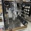 Black and white Rocket Espresso Appartamento lever coffee machine, ideal for use in households.