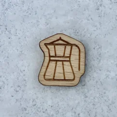 Wooden badge of the Order of the Golden Kettle with an engraved kettle symbol