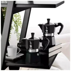 Two black Bialetti Moka Express coffee pots. Two black Bialetti Moka Express coffee pots.