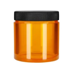 Orange coffee storage container from Comandante, ideal for storing coffee.