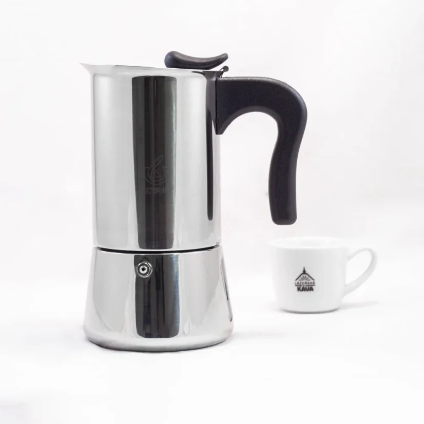 Silver moka pot with a black handle by Forever Miss Spendly Moka for 10 cups of coffee, accompanied by a cup of coffee.