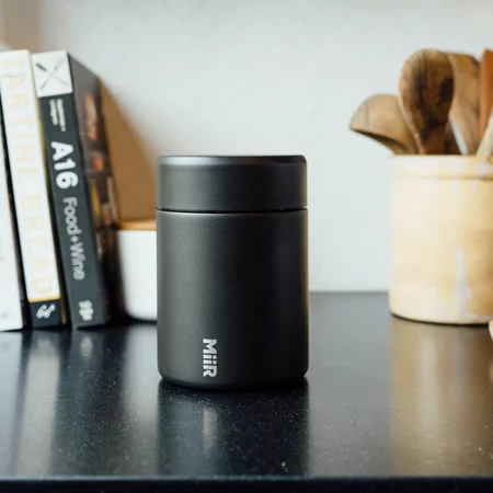 The Miir vacuum coffee container in white is perfect for keeping your coffee fresh.