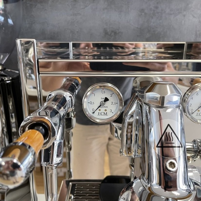 ECM Synchronika olive, home lever espresso machine, offers a hot water dispensing feature.