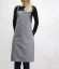 Tablier de barista gris avec poches, vue de face Tablier de barista gris avec poches, vue de face