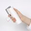 The Timemore C3 PRO manual grinder in white features a compact size.