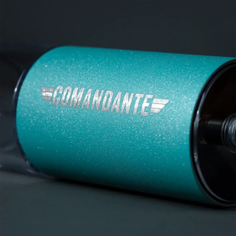 Detail of the grinding head of a Comandante hand grinder in Alpine Lagoon color.
