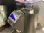Black Nuova Simonelli MDXS CORE espresso coffee grinder, marked as high quality.