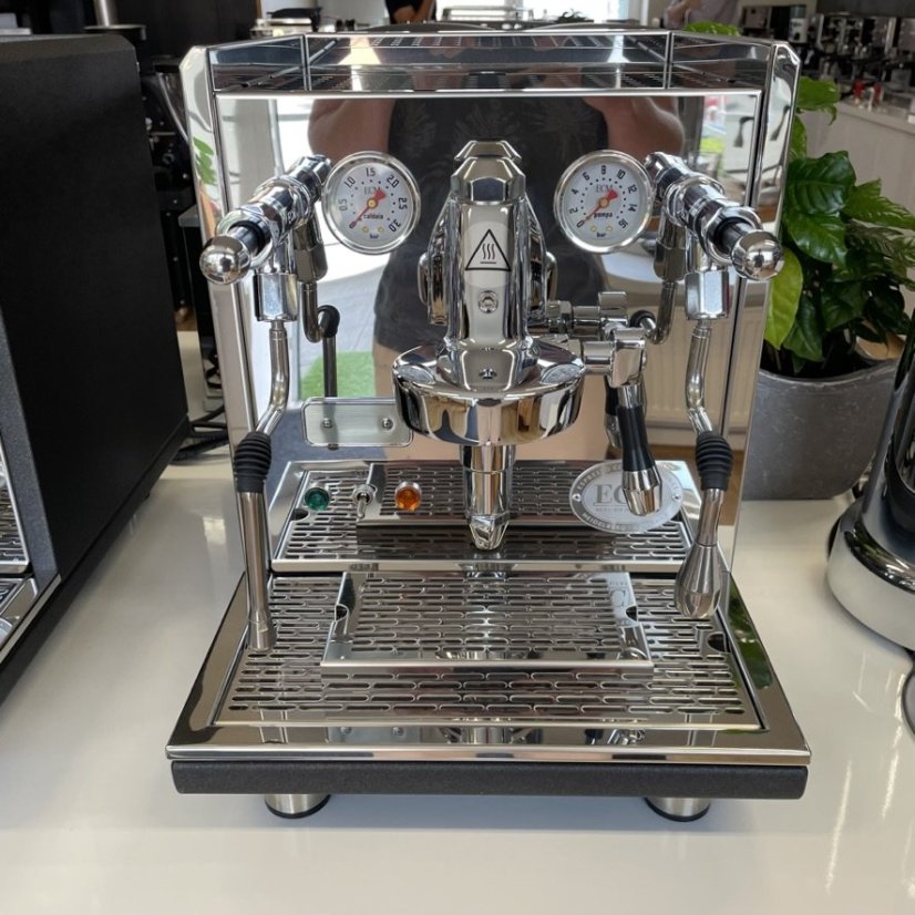 Two-tone home lever espresso machine ECM Synchronika adorned with chrome and black elements.
