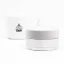 ECM Tamper with coffee in the background.