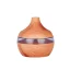 Wooden electric aroma diffuser in the shape of a volcano.