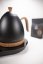 Kettle with elegant grip and temperature control on the base