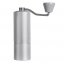 Silver grinder Timemore C2 for manual coffee grinding.