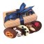 Gift wrapping including a bow and various chocolates.