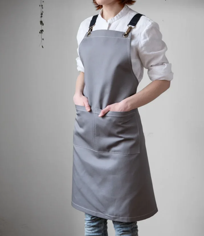 Tablier de barista gris avec des poches