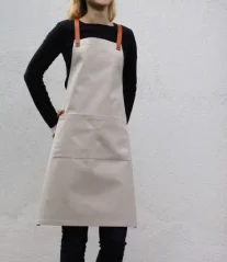 Beige barista apron with pockets, front view