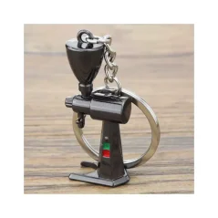 A stylish black coffee grinder keychain, perfect as a gift for coffee lovers.