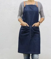 Denim blue barista apron with pockets, front view
