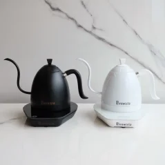 Elegant white Brewista kettle with a gooseneck and comfortable handle next to the same model in a luxurious matte black finish.