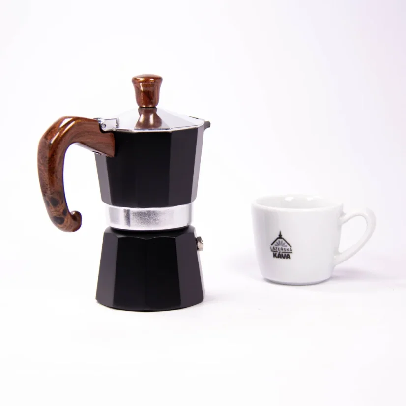 Moka pot by Forever from the back next to a coffee cup with a spa coffee logo.