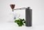 Timemore Nano mlynček so šálkou Spa kávy a rastlinou