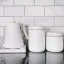 Fellow Atmos coffee canister in white color with a capacity of 1200 ml is made of high-quality stainless steel that ensures long durability and preserves the freshness of the coffee.
