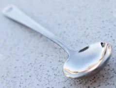 Rhinowares silver cupping spoon, front view