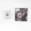 IMS basket in the original pink-gray box on a white background with a cup ; Portafilter baskets IMS basket in the original pink-gray box on a white background with a cup ; Portafilter baskets