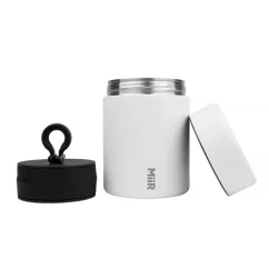 White vacuum coffee canister by MiiR keeps coffee fresh for longer.