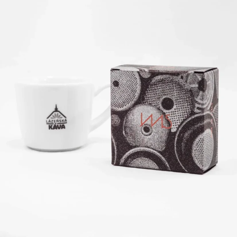 IMS basket for the portafilter in original packaging on a white background with a cup of coffee.