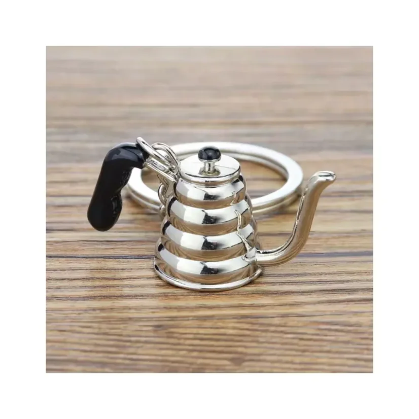 Porte-clés en forme de théière en argent, parfait pour les amateurs de café, qui ajoute du style à chaque trousseau de clés.