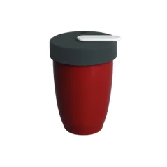 Red Loveramics Nomad travel mug with a 250 ml capacity, ideal for traveling.