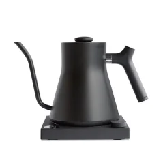 Black electric kettle on a black base against a white background