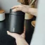 White Miir vacuum coffee canister keeps your coffee fresh.